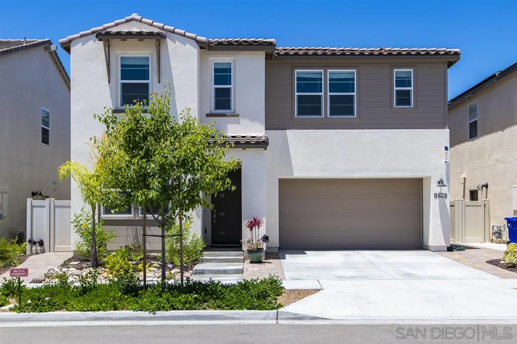 8828 Weston Road Santee, CA 92071 - Photo 2 of 25 a front view of a house with a yard and garage