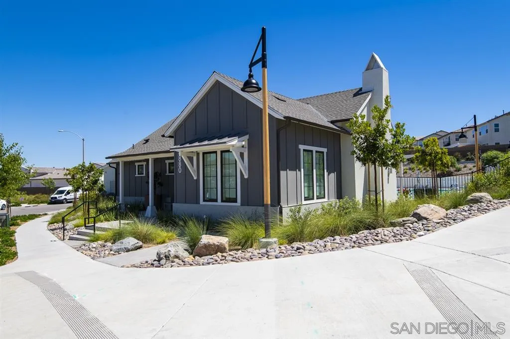 8828 Weston Road Santee, CA 92071 - Photo 24 of 25 a front view of a house with a yard and potted plants