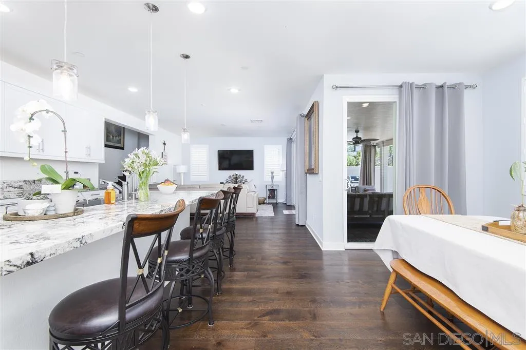 8828 Weston Road Santee, CA 92071 - Photo 6 of 25 a view of a dining room with furniture and wooden floor