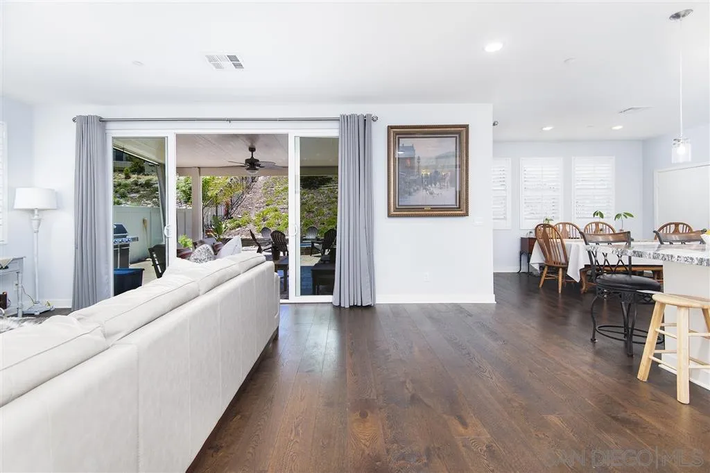 8828 Weston Road Santee, CA 92071 - Photo 7 of 25 a living room with furniture and a wooden floor