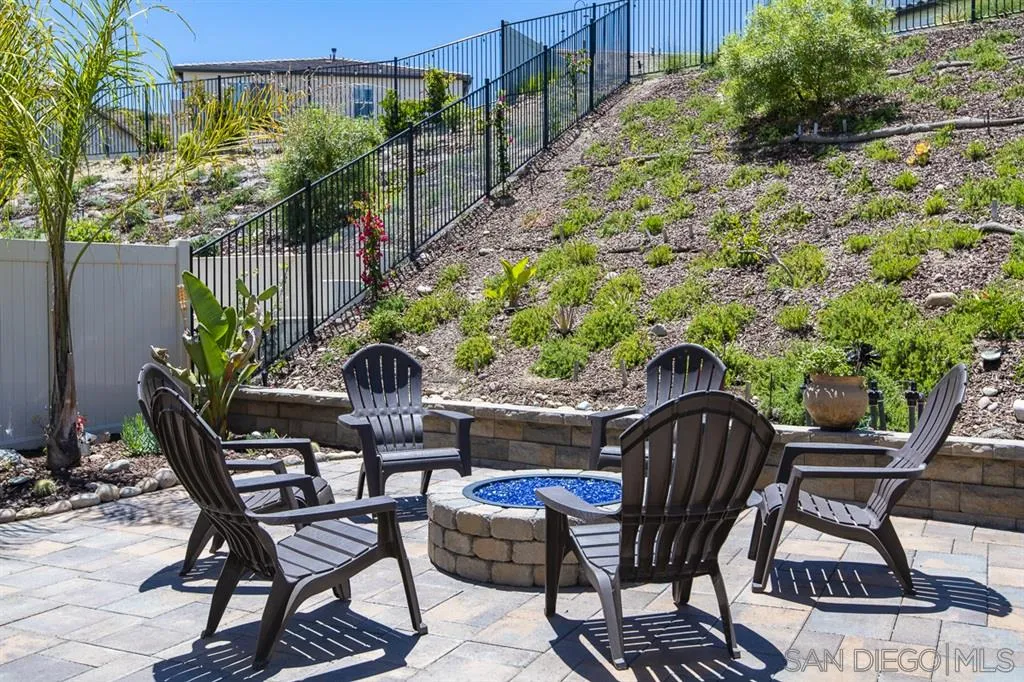 8828 Weston Road Santee, CA 92071 - Photo 8 of 25 a view of a chairs and table in backyard