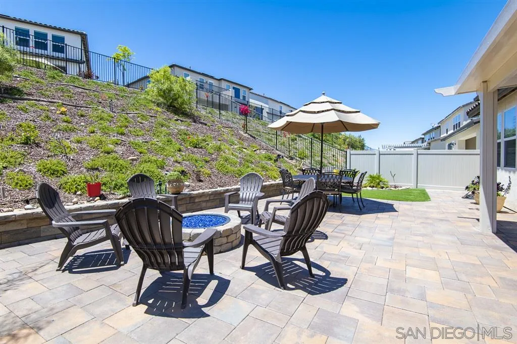 8828 Weston Road Santee, CA 92071 - Photo 9 of 25 a view of a chairs and table in a backyard