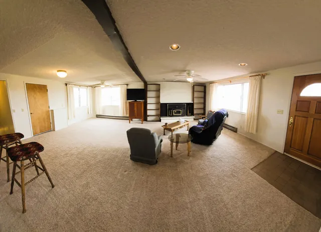 a view of a balcony with wooden fence