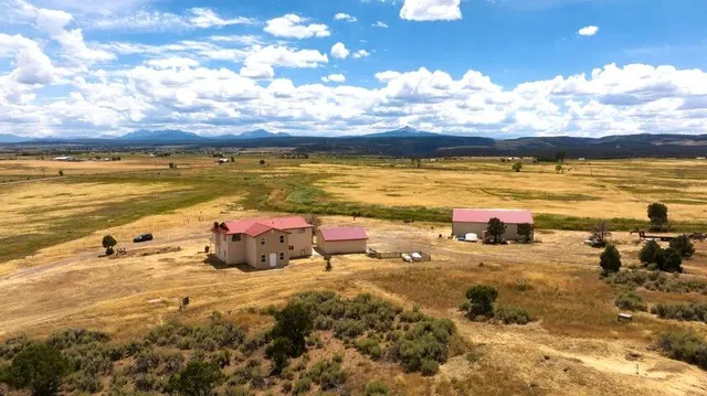a view of a house with a swimming pool