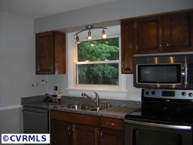 2001 Esquire Road Richmond, VA 23235 - Photo 2 of 10 a kitchen with a sink stove and microwave