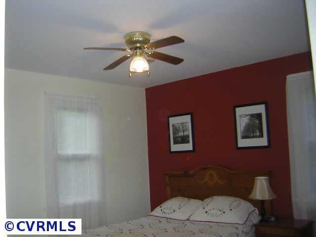 2001 Esquire Road Richmond, VA 23235 - Photo 8 of 10 a bathroom with a toilet a sink and a mirror