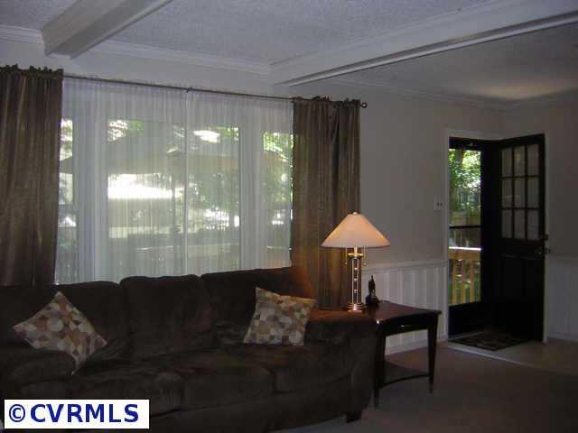 2001 Esquire Road Richmond, VA 23235 - Photo 10 of 10 a living room with furniture and a lamp