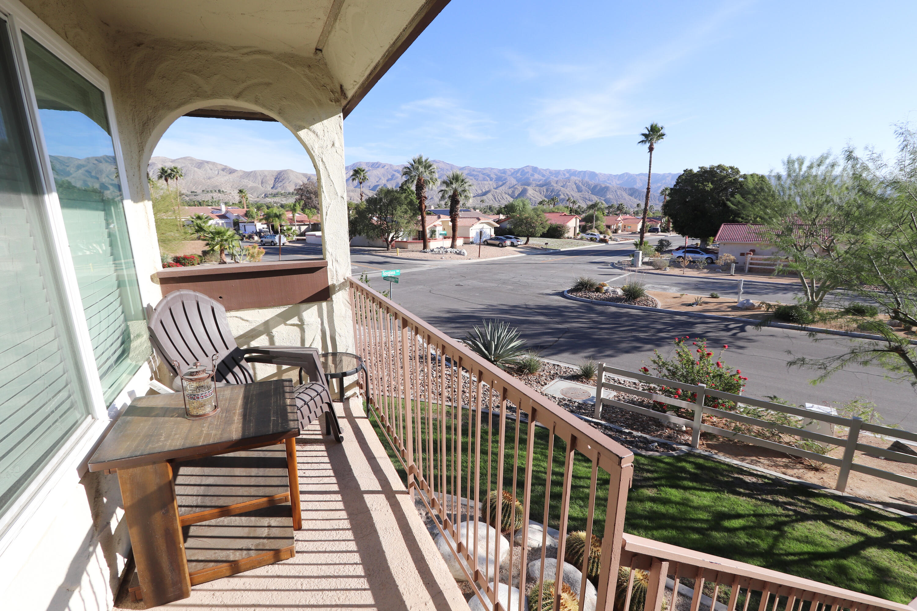 64291 Spyglass Avenue, Unit 2 Desert Hot Springs, CA 92240 - Photo 1 of 22 a view of a balcony with wooden floor