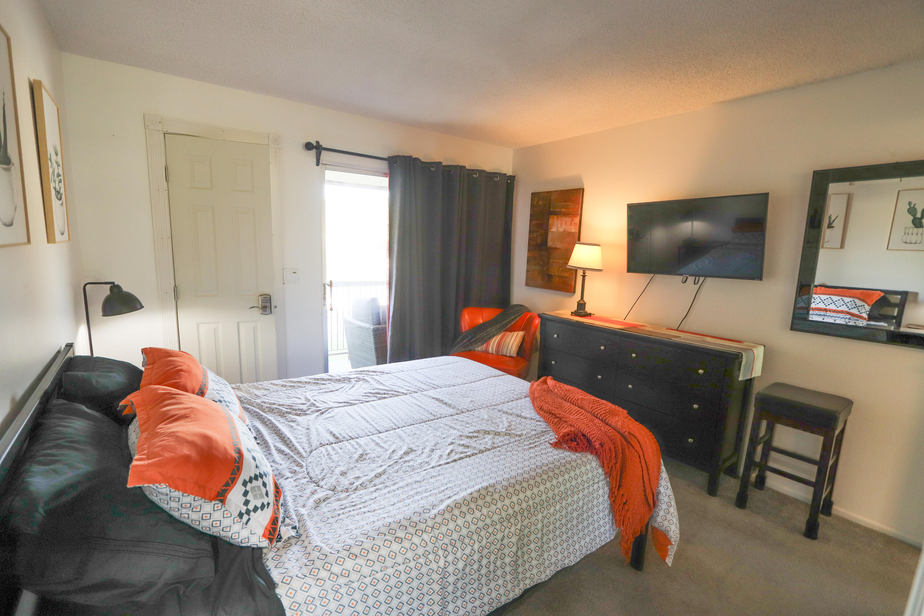 64291 Spyglass Avenue, Unit 2 Desert Hot Springs, CA 92240 - Photo 11 of 22 a bedroom with a bed and a flat screen tv
