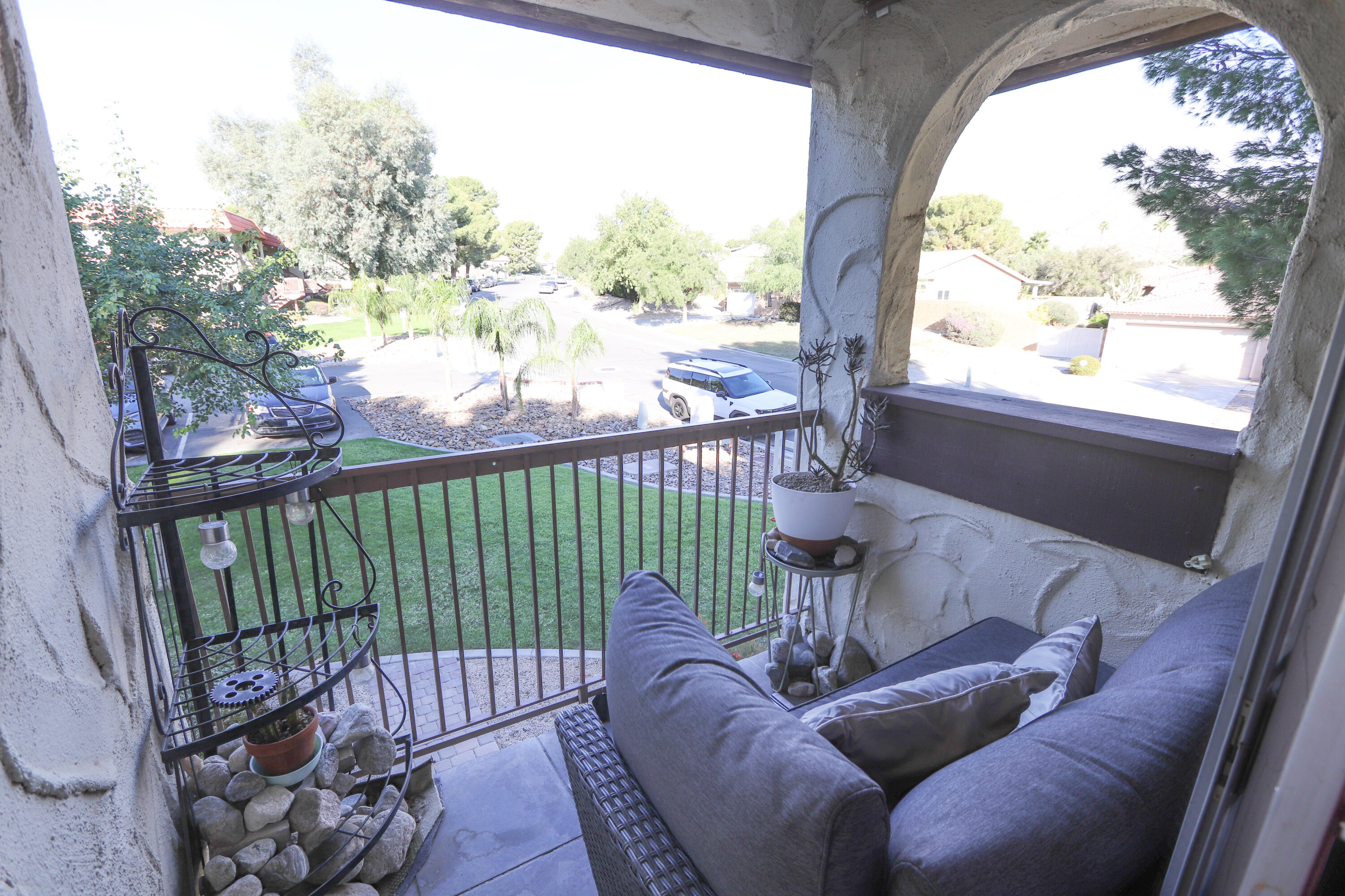 64291 Spyglass Avenue, Unit 2 Desert Hot Springs, CA 92240 - Photo 13 of 22 a view of a porch with furniture