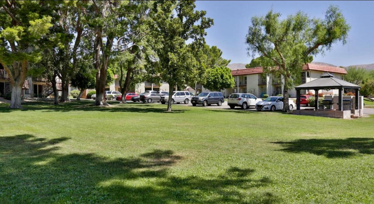 64291 Spyglass Avenue, Unit 2 Desert Hot Springs, CA 92240 - Photo 18 of 22 a front view of a building with garden