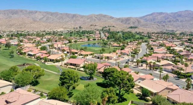 an aerial view of residential house with outdoor space and river