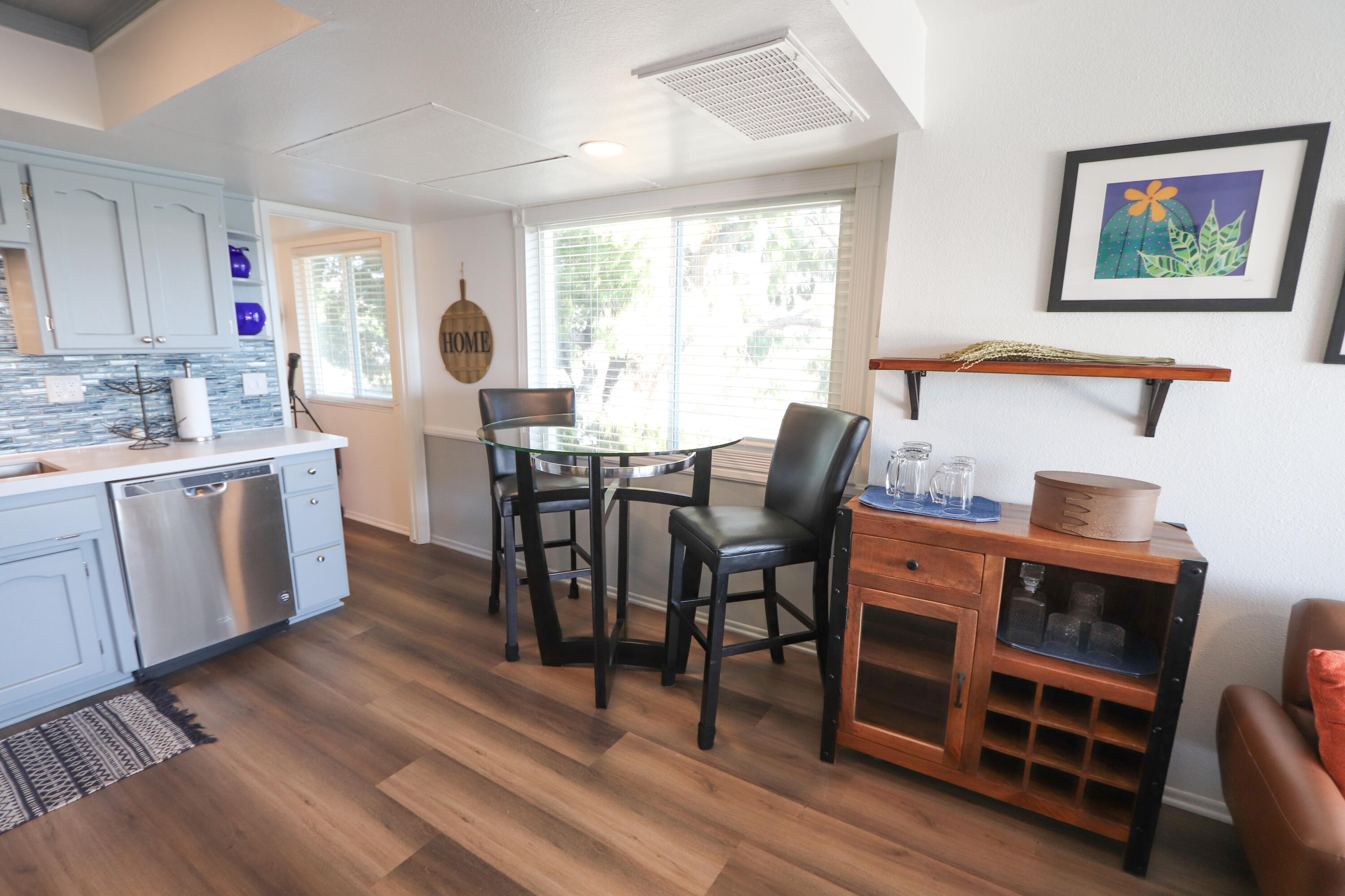 64291 Spyglass Avenue, Unit 2 Desert Hot Springs, CA 92240 - Photo 3 of 22 a view of a dining room with furniture window and wooden floor