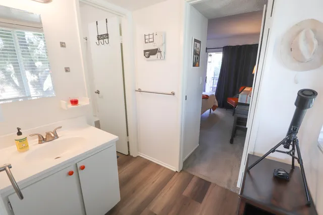 a utility room with cabinets washer and dryer