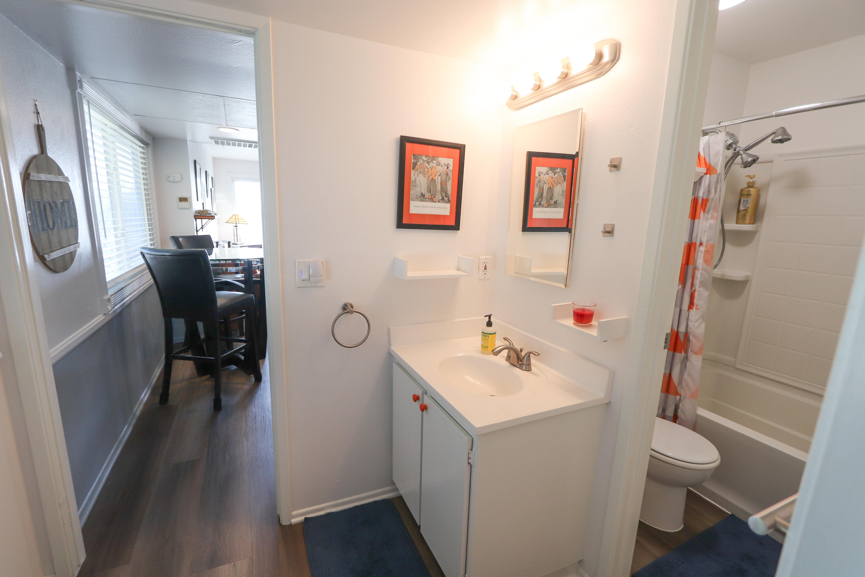 64291 Spyglass Avenue, Unit 2 Desert Hot Springs, CA 92240 - Photo 9 of 22 a bathroom with a sink a toilet and a mirror
