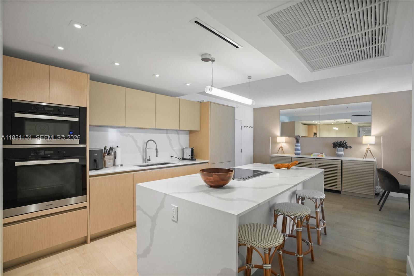 2301 Collins Avenue, Unit 407 Miami Beach, FL 33139 - Photo 11 of 48 a kitchen with a stove a sink and a refrigerator