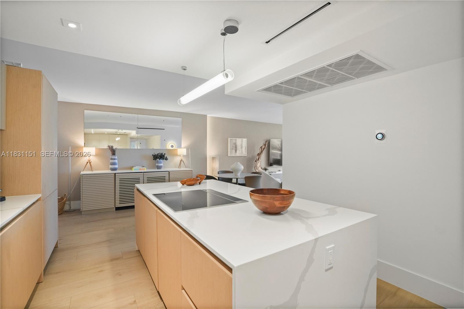 2301 Collins Avenue, Unit 407 Miami Beach, FL 33139 - Photo 12 of 48 a kitchen with a sink a stove and chairs