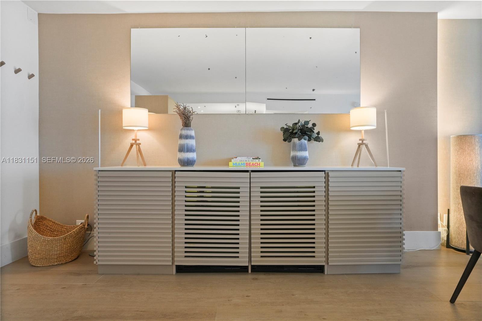 2301 Collins Avenue, Unit 407 Miami Beach, FL 33139 - Photo 13 of 48 a bathroom with a sink and a mirror