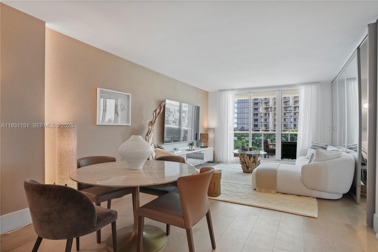 2301 Collins Avenue, Unit 407 Miami Beach, FL 33139 - Photo 14 of 48 a living room with furniture and a window
