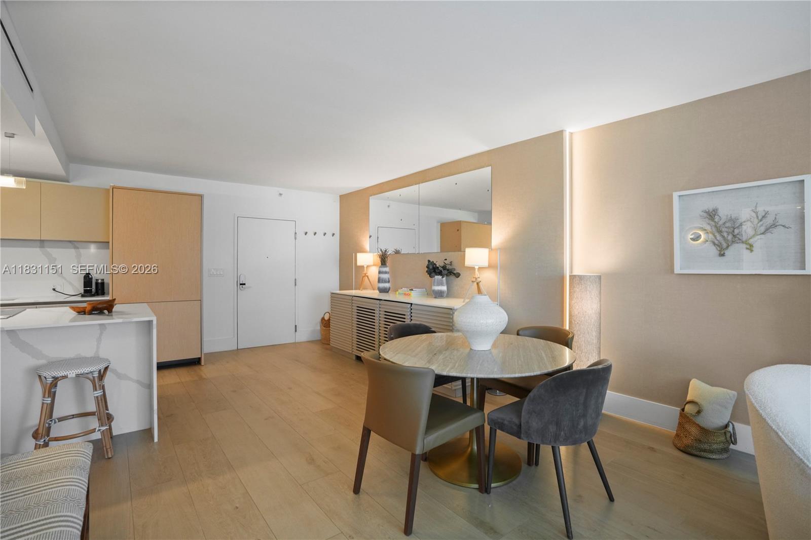 2301 Collins Avenue, Unit 407 Miami Beach, FL 33139 - Photo 15 of 48 a view of a dining room with furniture and a kitchen