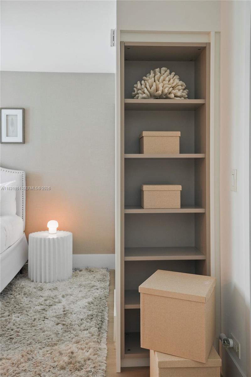 2301 Collins Avenue, Unit 407 Miami Beach, FL 33139 - Photo 22 of 48 a room with a cabinets and a stove