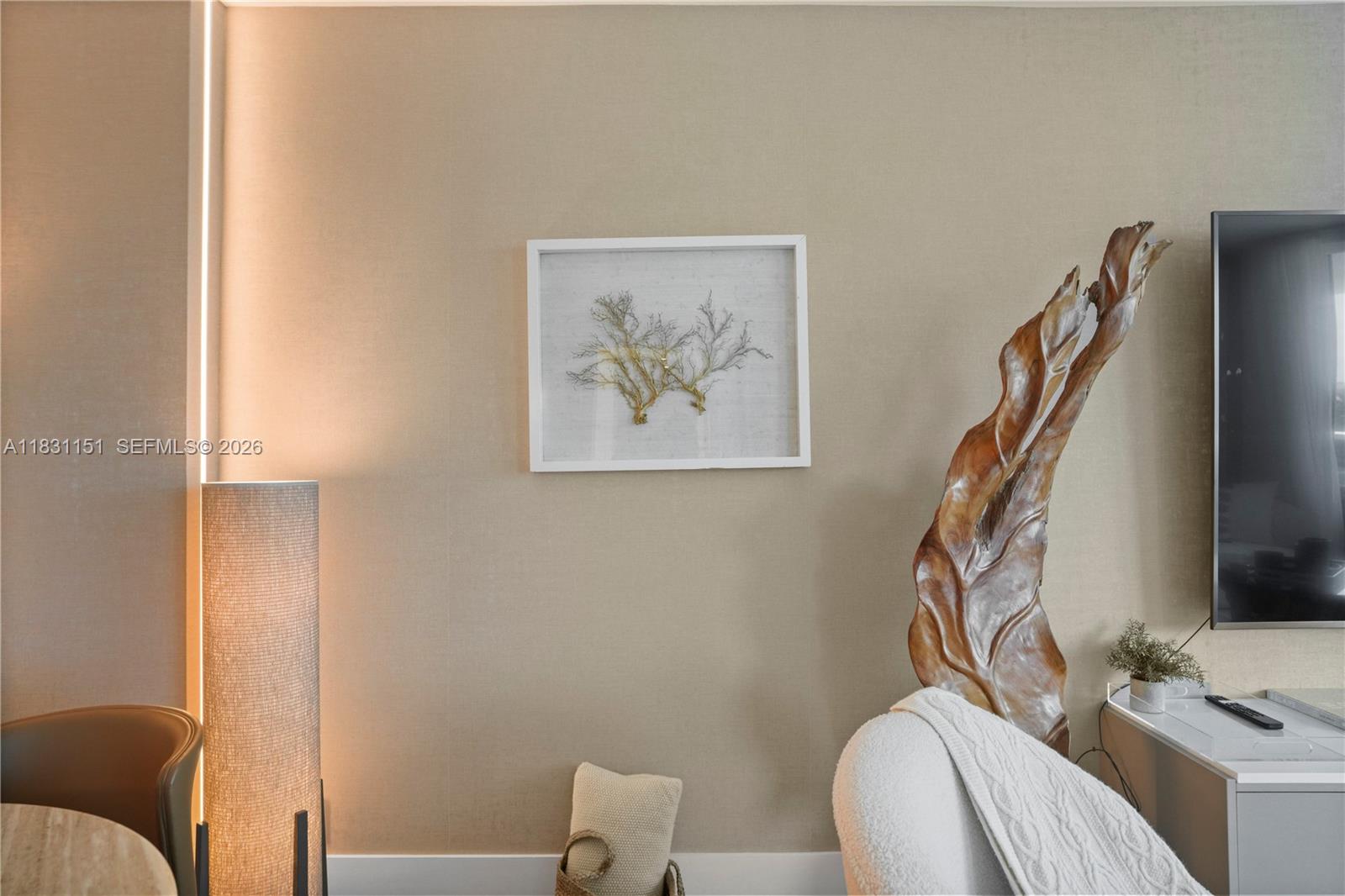 2301 Collins Avenue, Unit 407 Miami Beach, FL 33139 - Photo 23 of 48 a living room with furniture and a flat screen tv