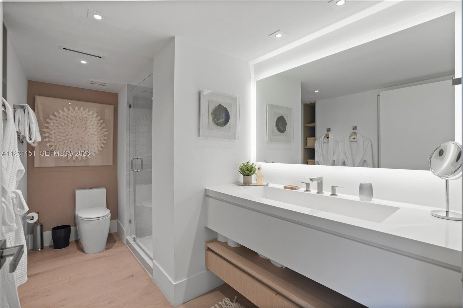 2301 Collins Avenue, Unit 407 Miami Beach, FL 33139 - Photo 25 of 48 a bathroom with a sink and a mirror