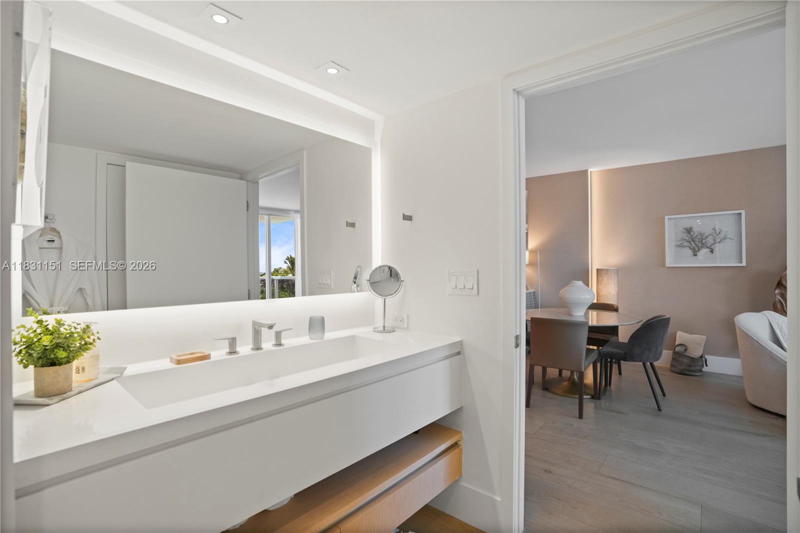 2301 Collins Avenue, Unit 407 Miami Beach, FL 33139 - Photo 26 of 48 a en suite bathroom with a sink and a mirror