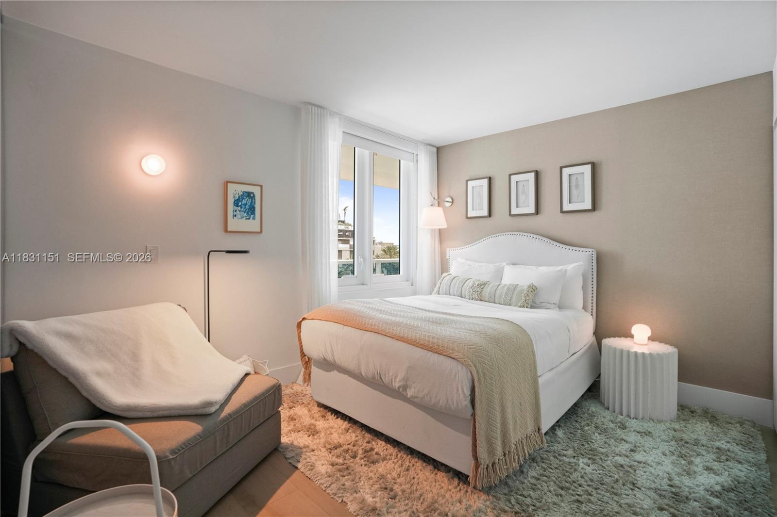 2301 Collins Avenue, Unit 407 Miami Beach, FL 33139 - Photo 3 of 48 a bedroom with a bed and chair