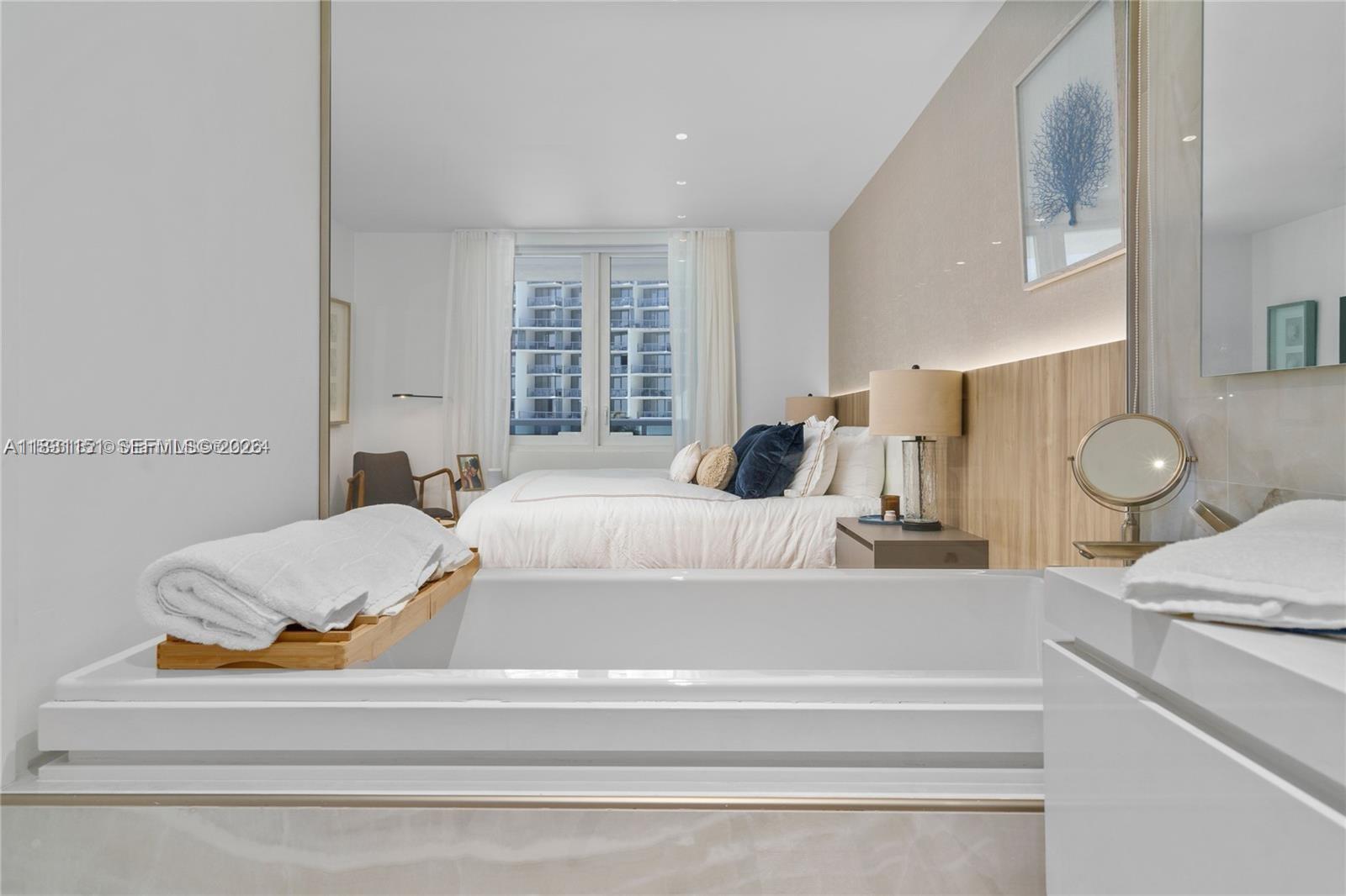 2301 Collins Avenue, Unit 407 Miami Beach, FL 33139 - Photo 31 of 48 a bedroom with a bed and window