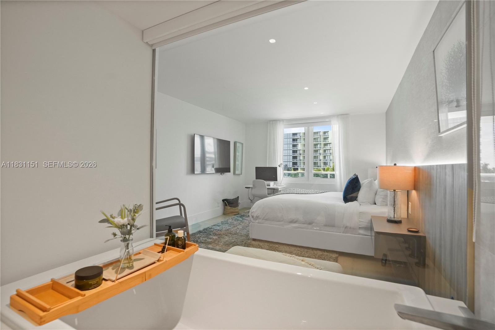 2301 Collins Avenue, Unit 407 Miami Beach, FL 33139 - Photo 32 of 48 a bedroom with bed and window