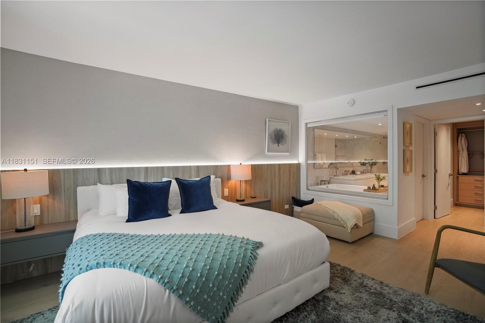 2301 Collins Avenue, Unit 407 Miami Beach, FL 33139 - Photo 36 of 48 a bedroom with double bed and a night stand