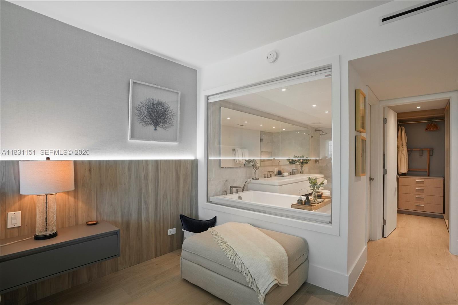 2301 Collins Avenue, Unit 407 Miami Beach, FL 33139 - Photo 37 of 48 a bedroom with a bed and lamp