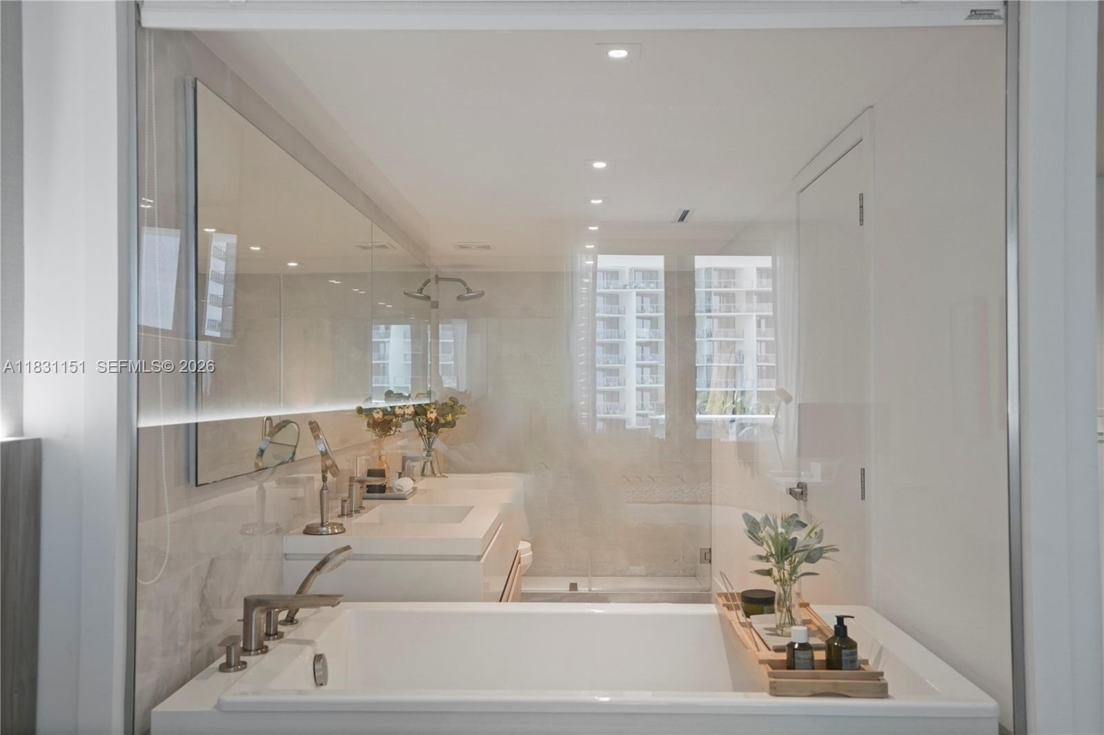 2301 Collins Avenue, Unit 407 Miami Beach, FL 33139 - Photo 38 of 48 a bathroom with a bathtub and a sink