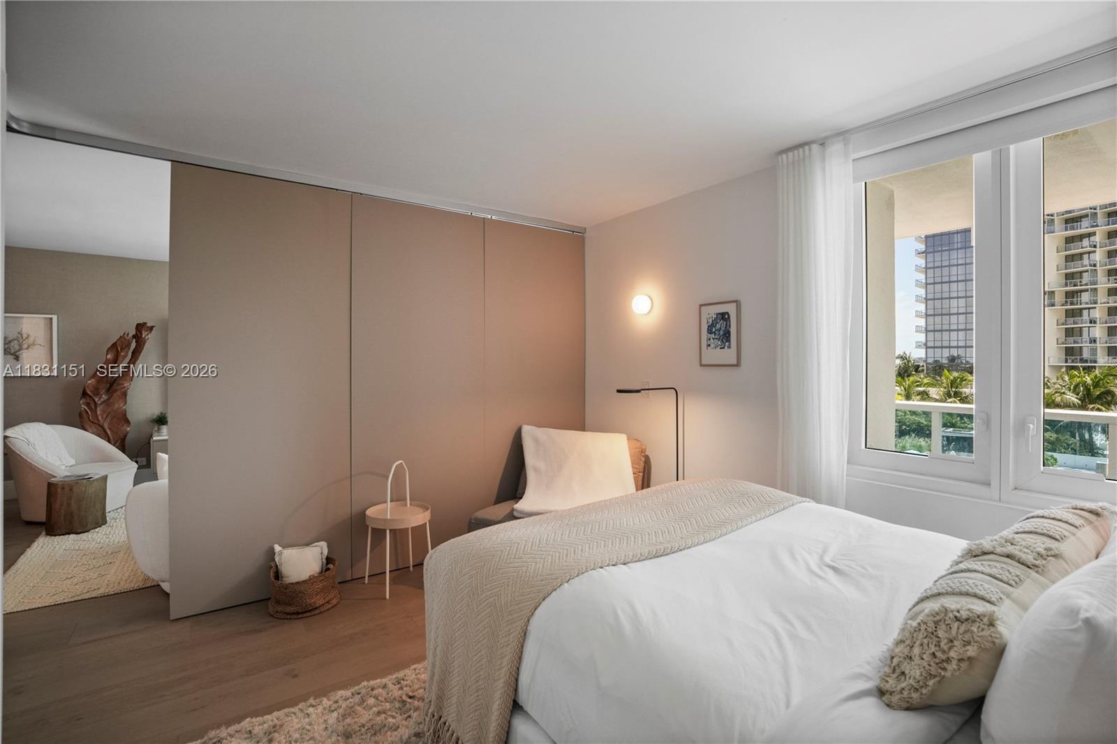 2301 Collins Avenue, Unit 407 Miami Beach, FL 33139 - Photo 4 of 48 a bedroom with a bed and a window
