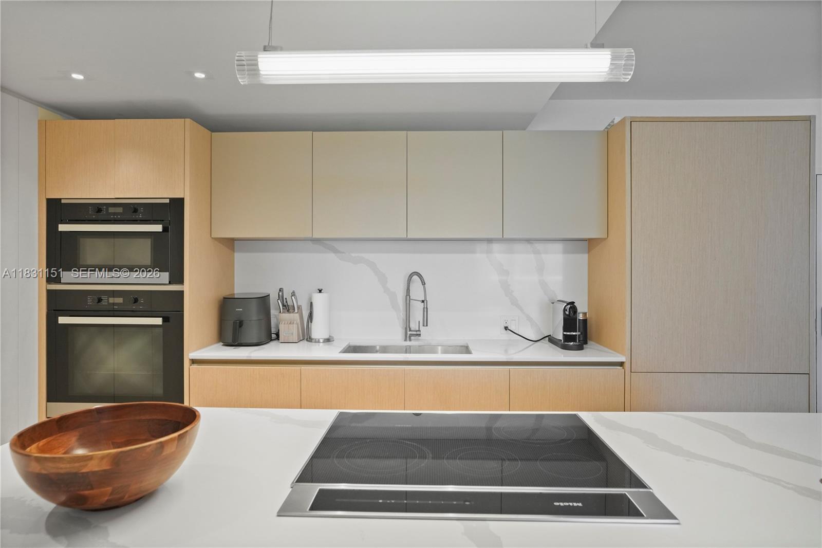 2301 Collins Avenue, Unit 407 Miami Beach, FL 33139 - Photo 47 of 48 a view of kitchen with stainless steel appliances granite countertop a sink and a stove