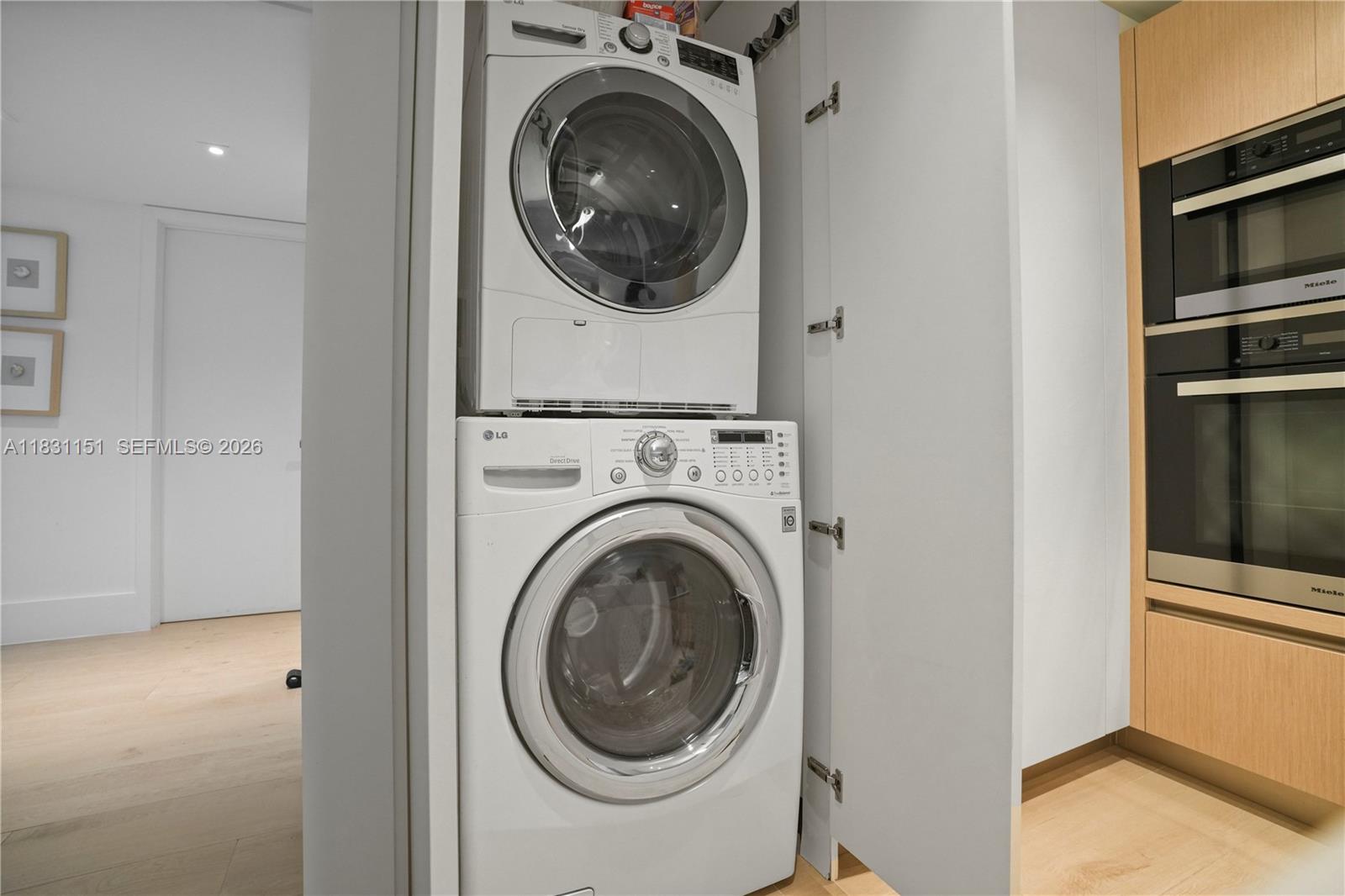 2301 Collins Avenue, Unit 407 Miami Beach, FL 33139 - Photo 48 of 48 a view of a hallway with washer and dryer