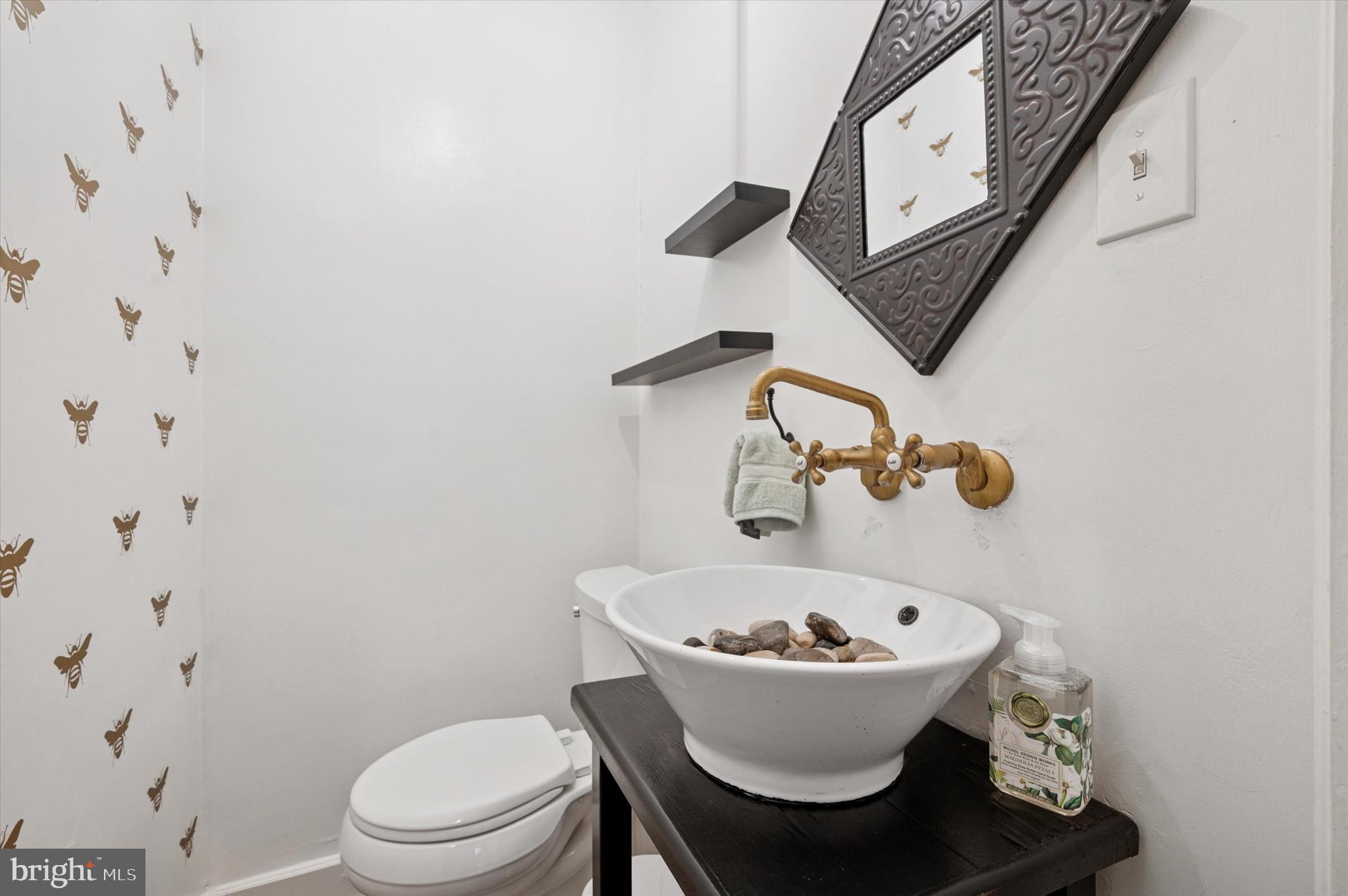 211 Ladbroke Road Bryn Mawr, PA 19010 - Photo 12 of 38 a bathroom with a sink and a toilet