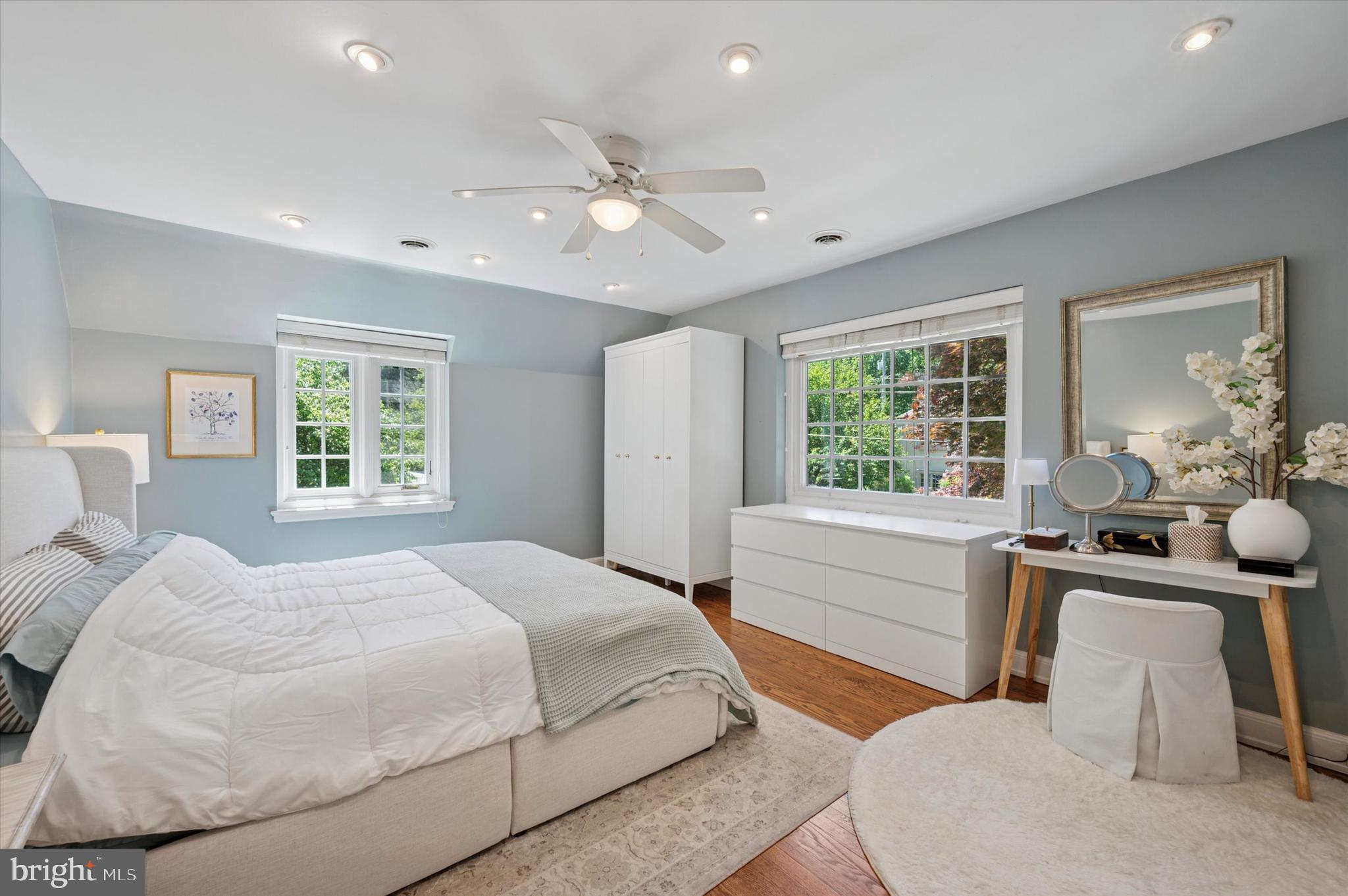 211 Ladbroke Road Bryn Mawr, PA 19010 - Photo 20 of 38 a spacious bedroom with a large bed and a table