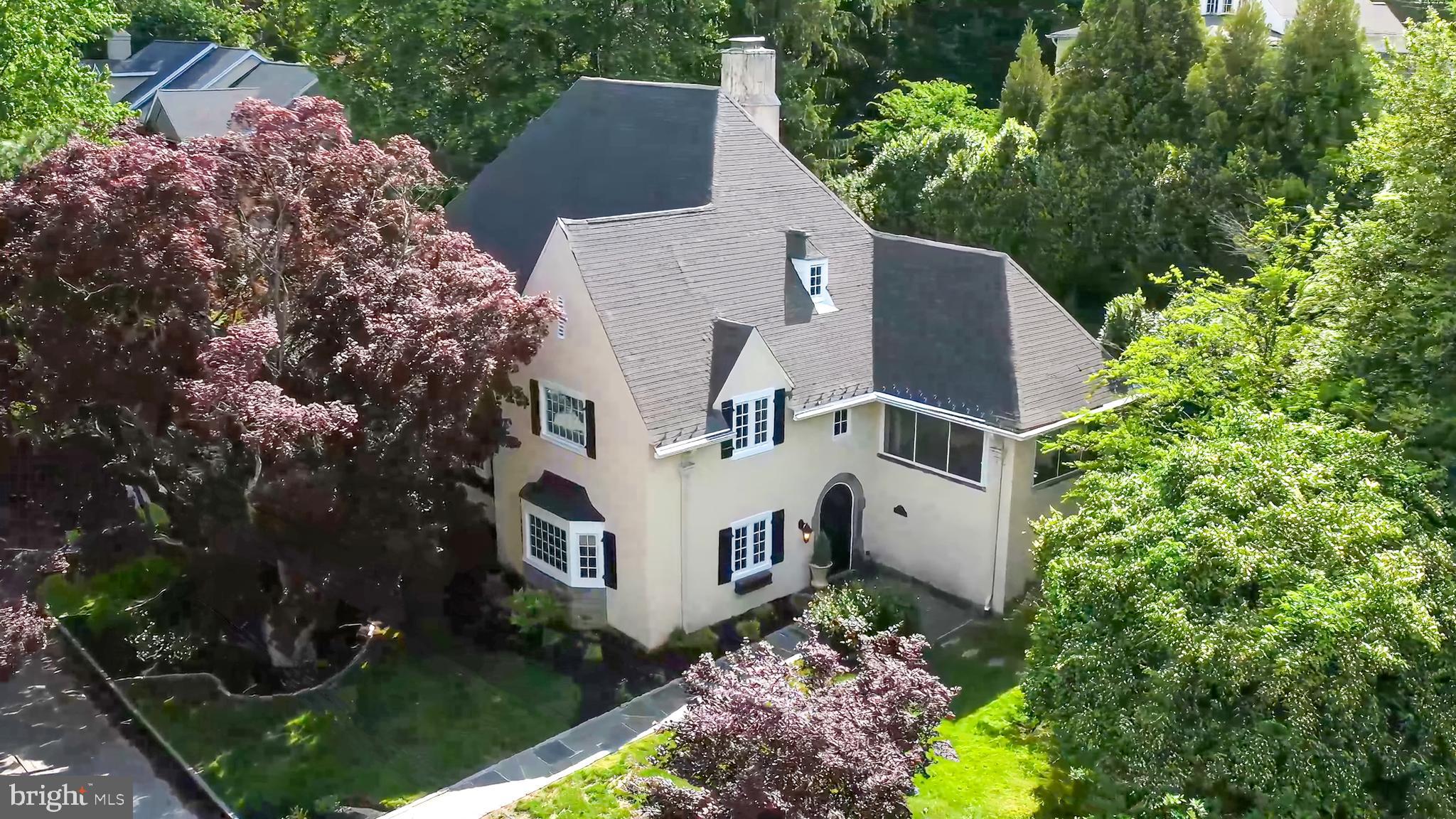 211 Ladbroke Road Bryn Mawr, PA 19010 - Photo 2 of 38 front view of house with a yard