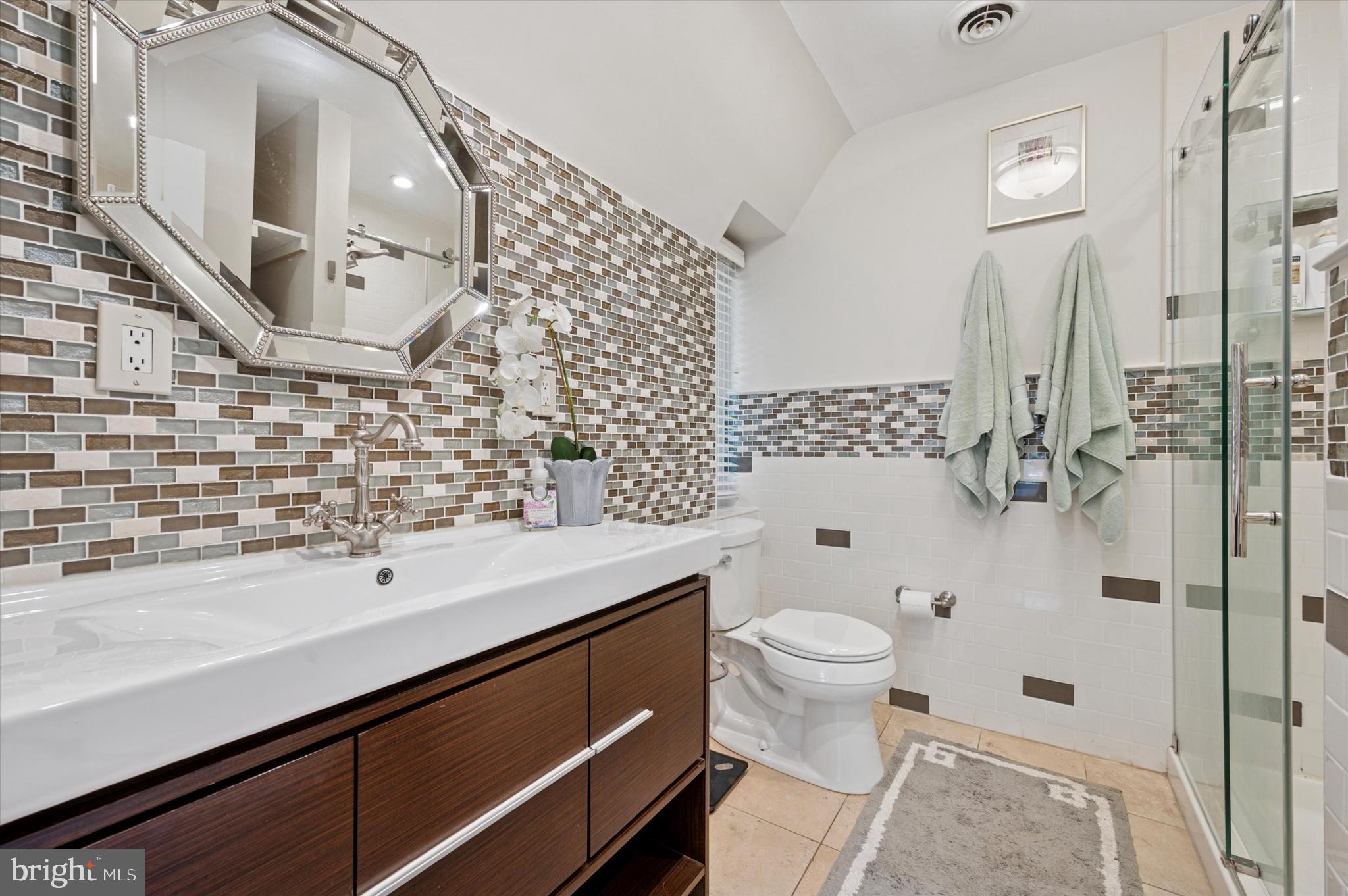 211 Ladbroke Road Bryn Mawr, PA 19010 - Photo 22 of 38 a bathroom with a sink a toilet and shower
