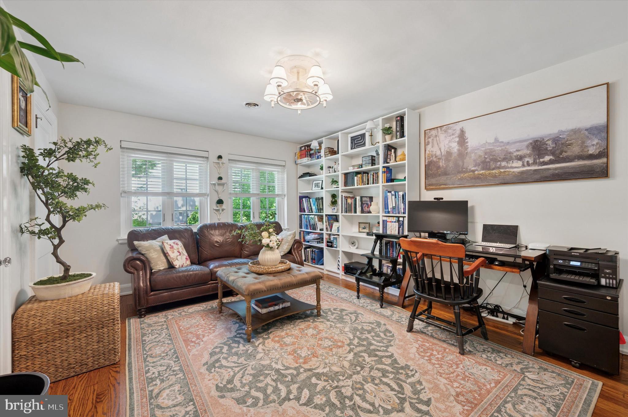 211 Ladbroke Road Bryn Mawr, PA 19010 - Photo 26 of 38 a living room with furniture and a bookshelf
