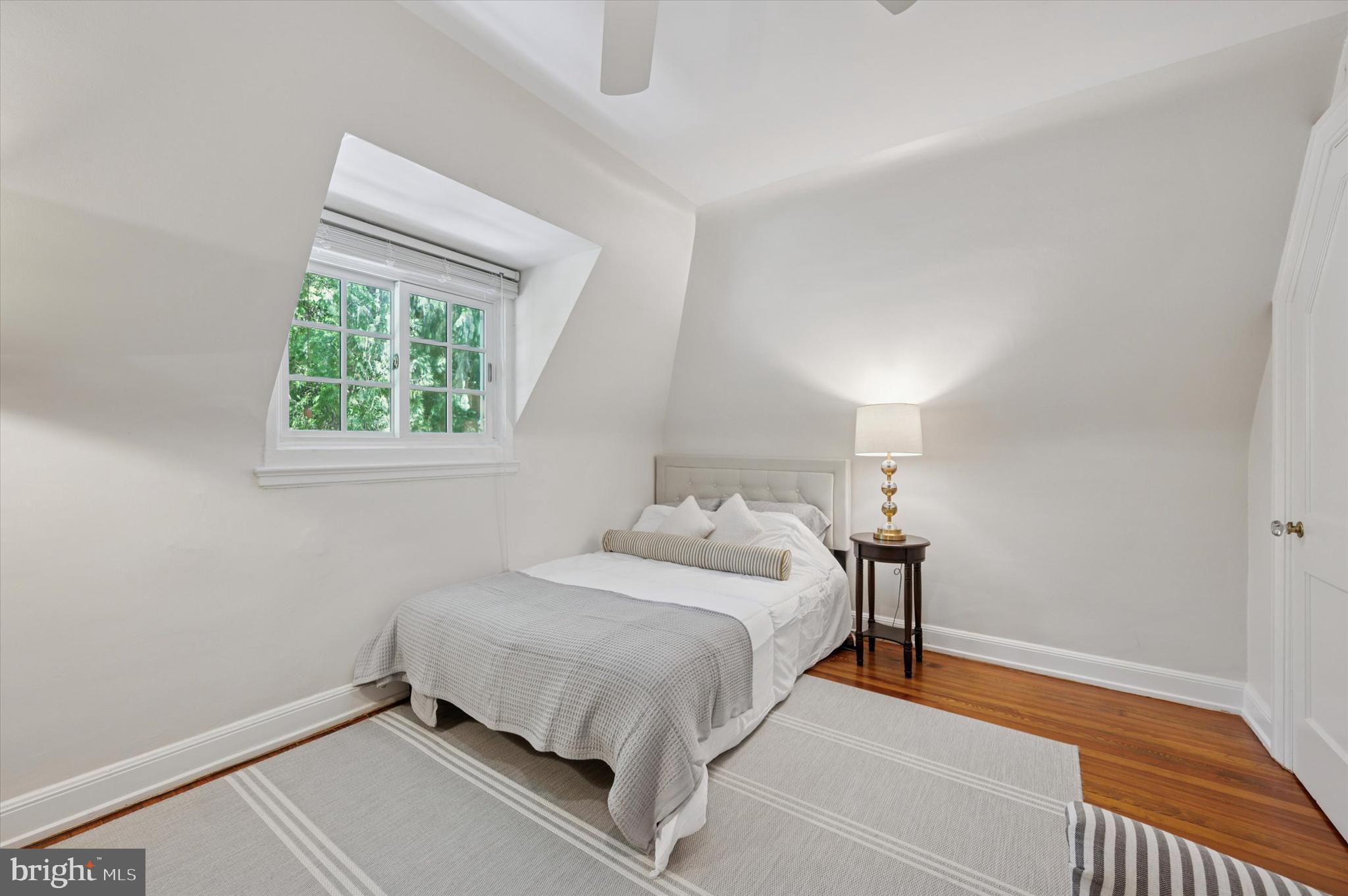 211 Ladbroke Road Bryn Mawr, PA 19010 - Photo 27 of 38 a bedroom with a bed and a window