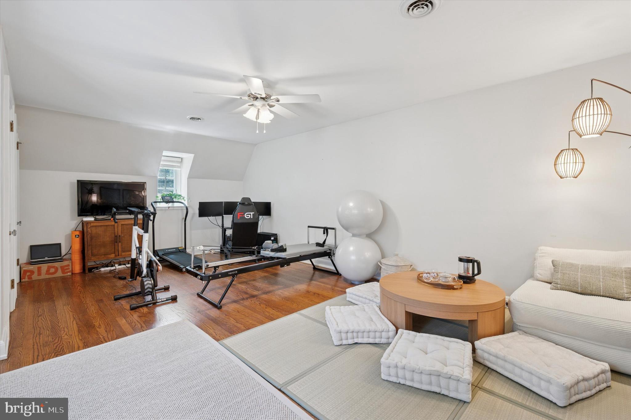 211 Ladbroke Road Bryn Mawr, PA 19010 - Photo 30 of 38 a living room with furniture a flat screen tv and a window