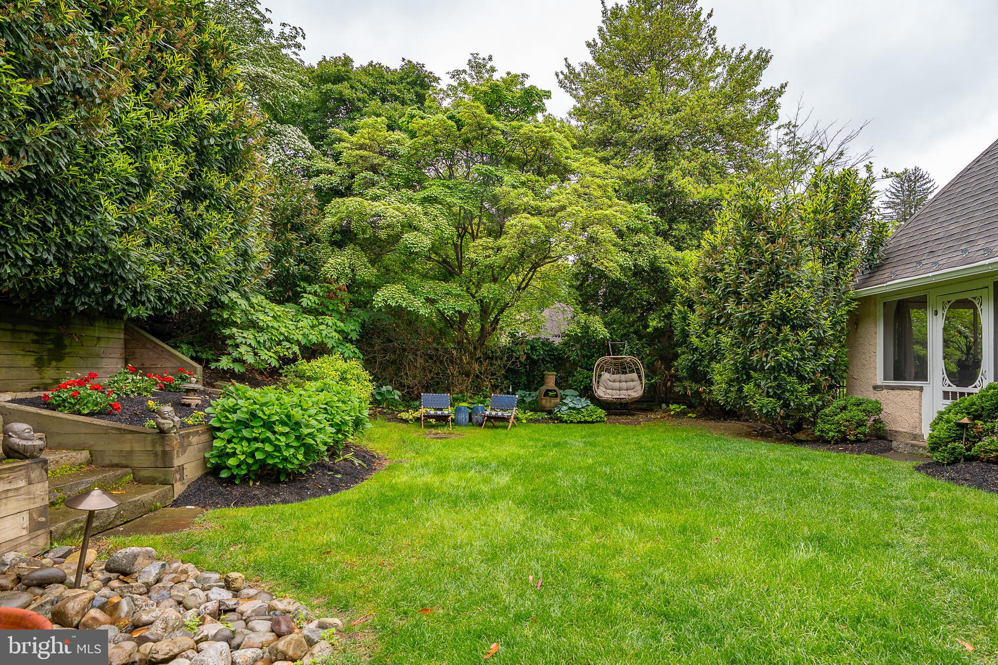 211 Ladbroke Road Bryn Mawr, PA 19010 - Photo 34 of 38 a backyard of a house with lots of green space