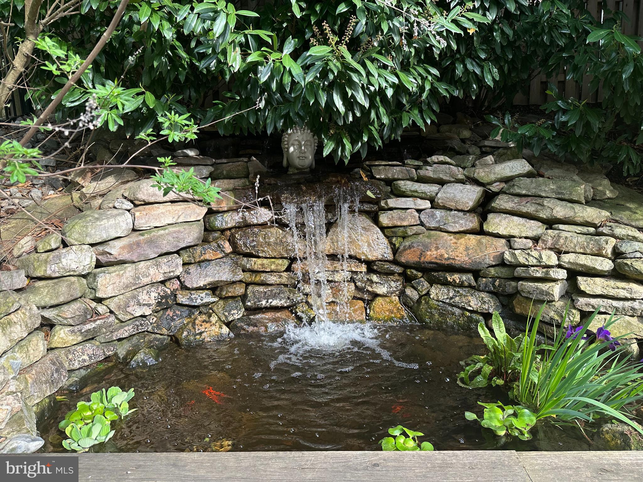 211 Ladbroke Road Bryn Mawr, PA 19010 - Photo 36 of 38 a view of a garden with a bench