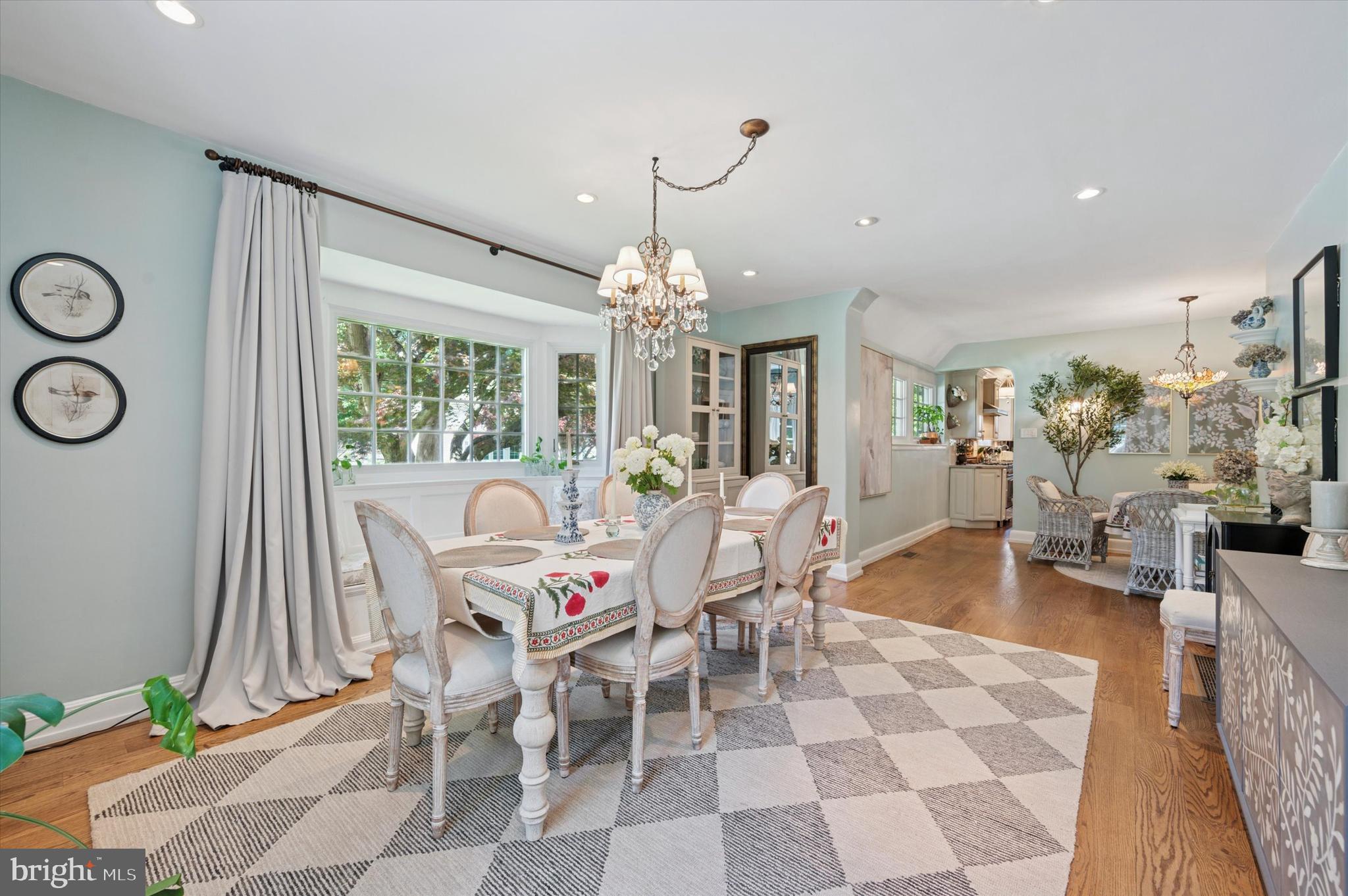 211 Ladbroke Road Bryn Mawr, PA 19010 - Photo 6 of 38 a dining room with furniture a chandelier and wooden floor