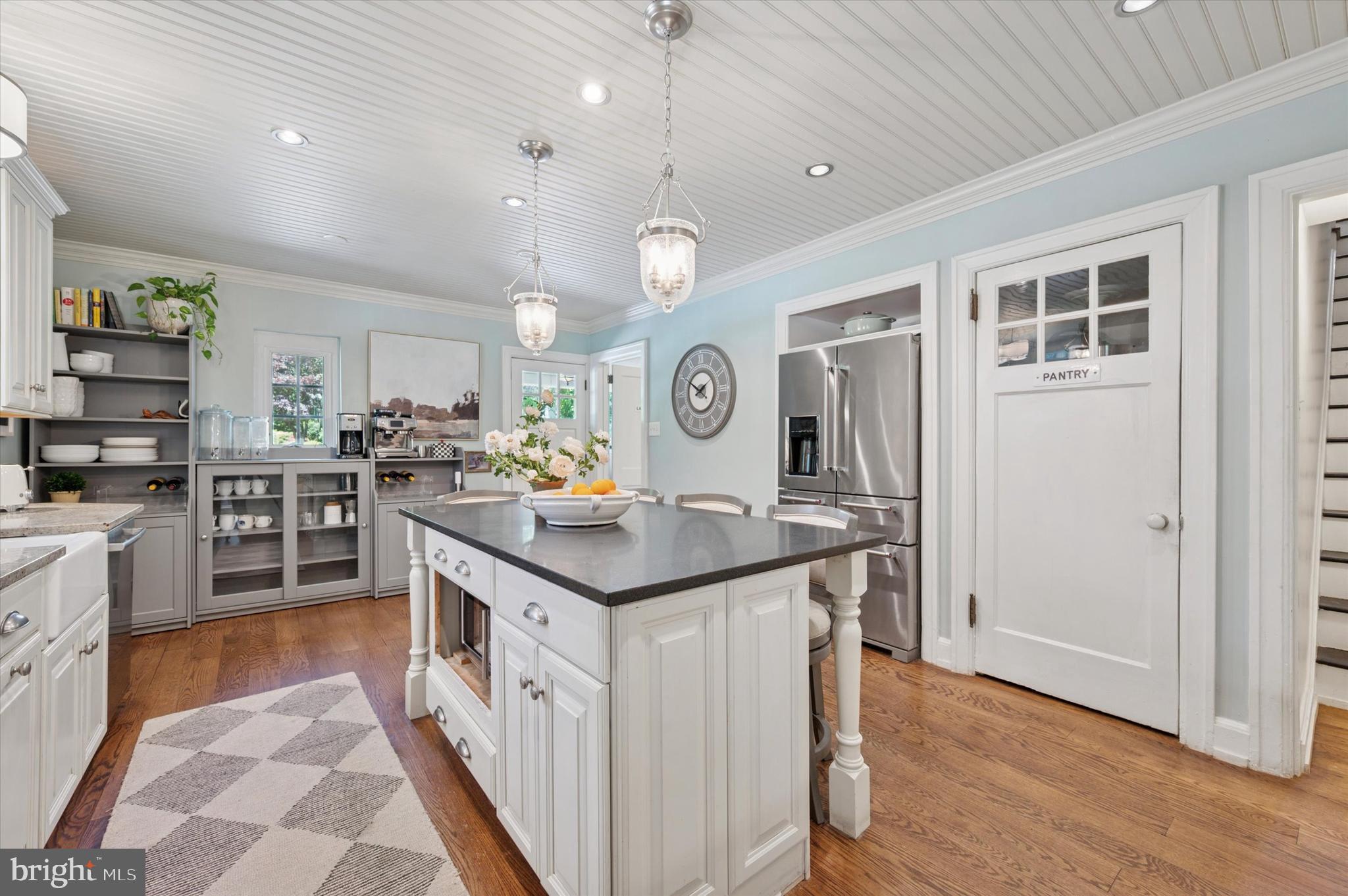 211 Ladbroke Road Bryn Mawr, PA 19010 - Photo 10 of 38 a kitchen with stainless steel appliances granite countertop a sink and cabinets