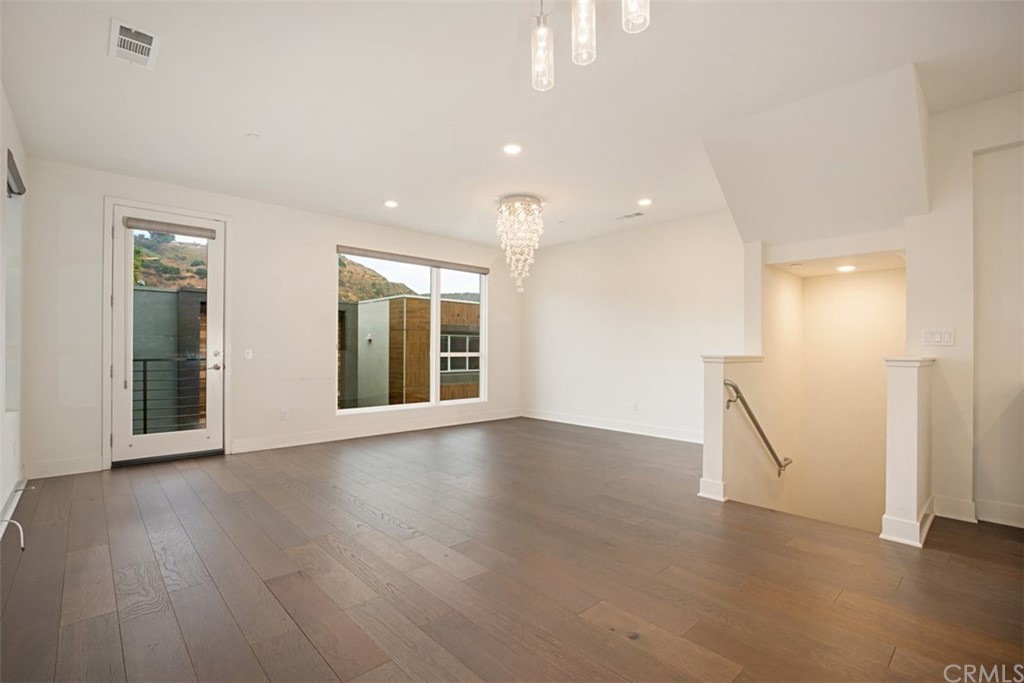 2771 Wright Lane Los Angeles, CA 90068 - Photo 14 of 31 a view of an empty room with wooden floor and a window