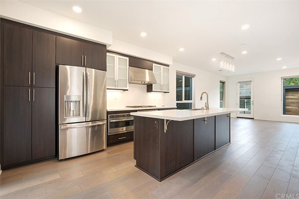 2771 Wright Lane Los Angeles, CA 90068 - Photo 18 of 31 a kitchen with stainless steel appliances kitchen island granite countertop a refrigerator a sink and a stove